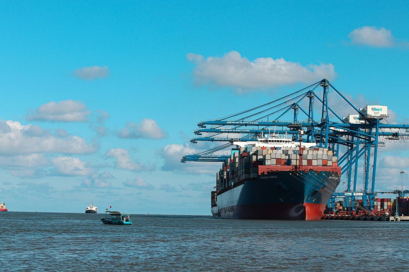 UK to India removals — container ship at Indian port representing The Indian Mover London to India moving company service