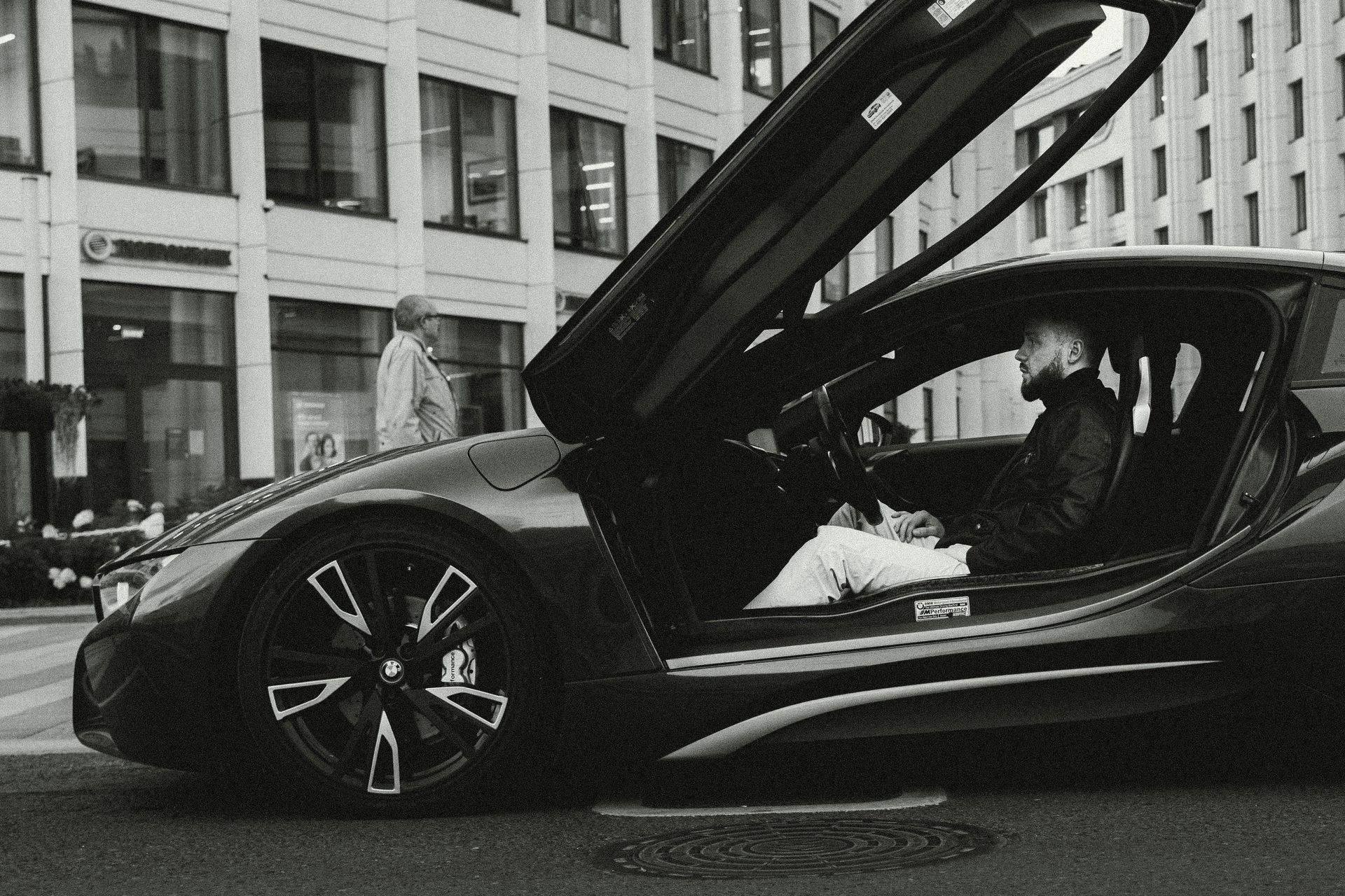BMW i8 with butterfly doors open — exotic car shipping UK specialist The Supercar Mover, London