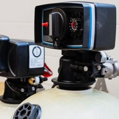 Close-up of robotic camera sensors mounted on a white dome, with black and blue housings