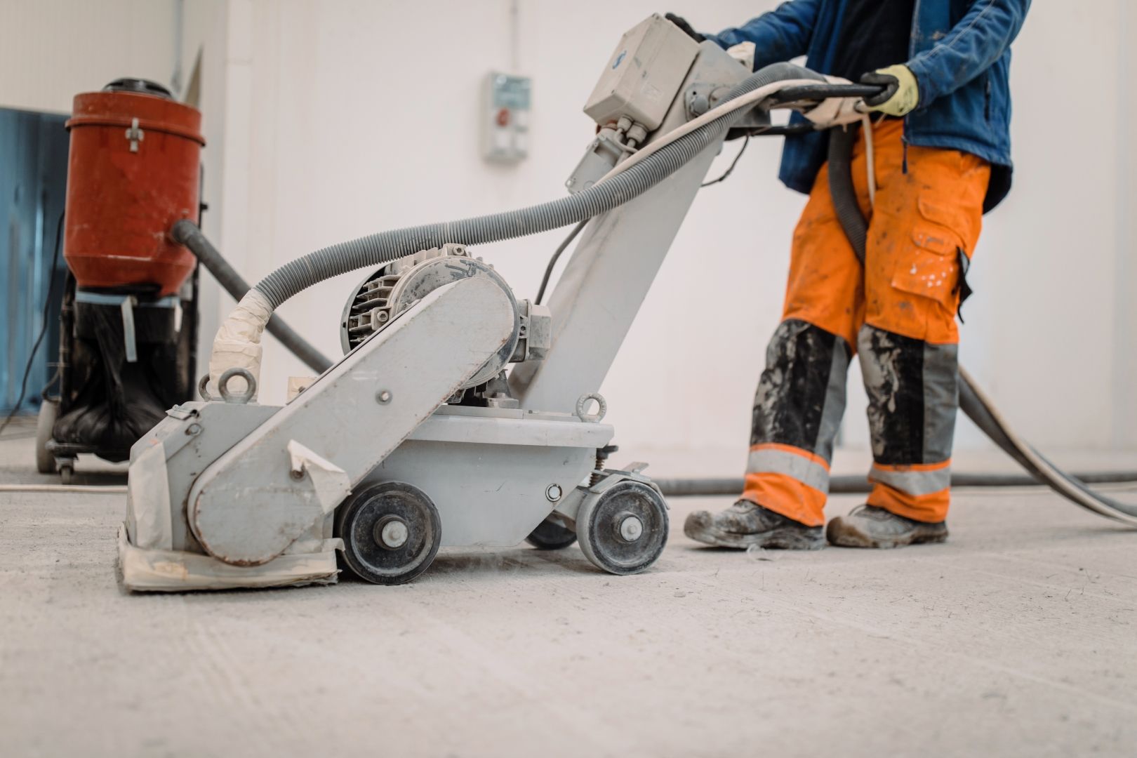 A Man is Using a Machine to Sand a Concrete Floor — Goat Collective in Tintenbar, NSW