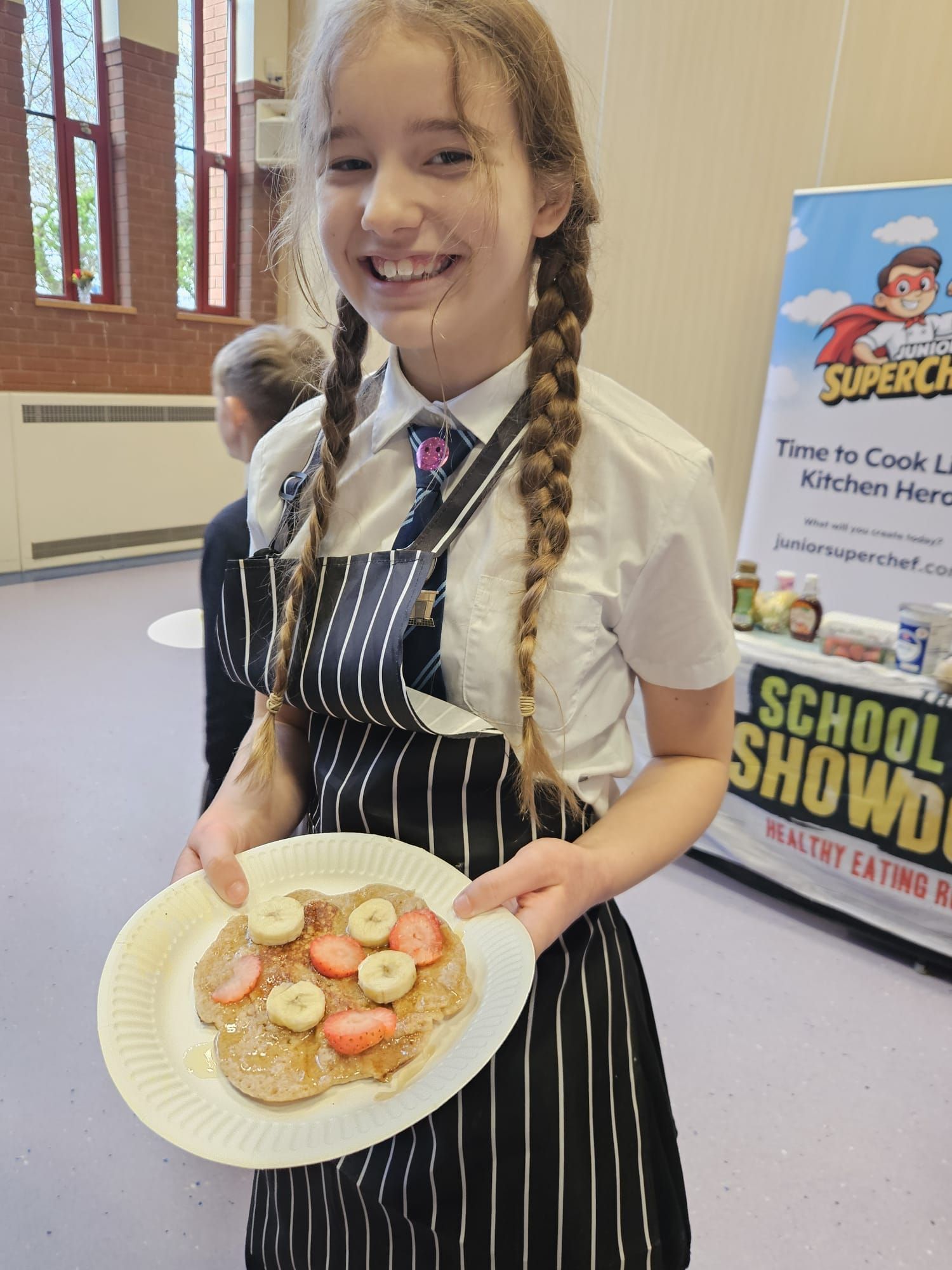 Primary school pupil taking part in the Junior SuperChef hands-on school cooking workshop