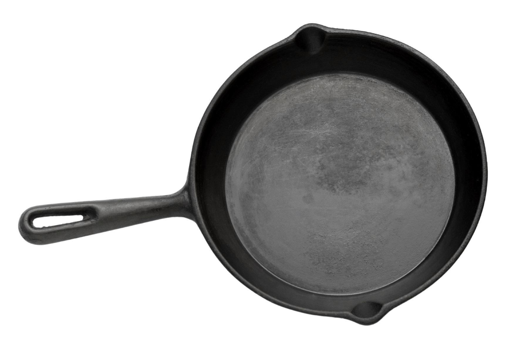 Black cast iron skillet, top-down view, with handle and pouring spouts, on a white background.