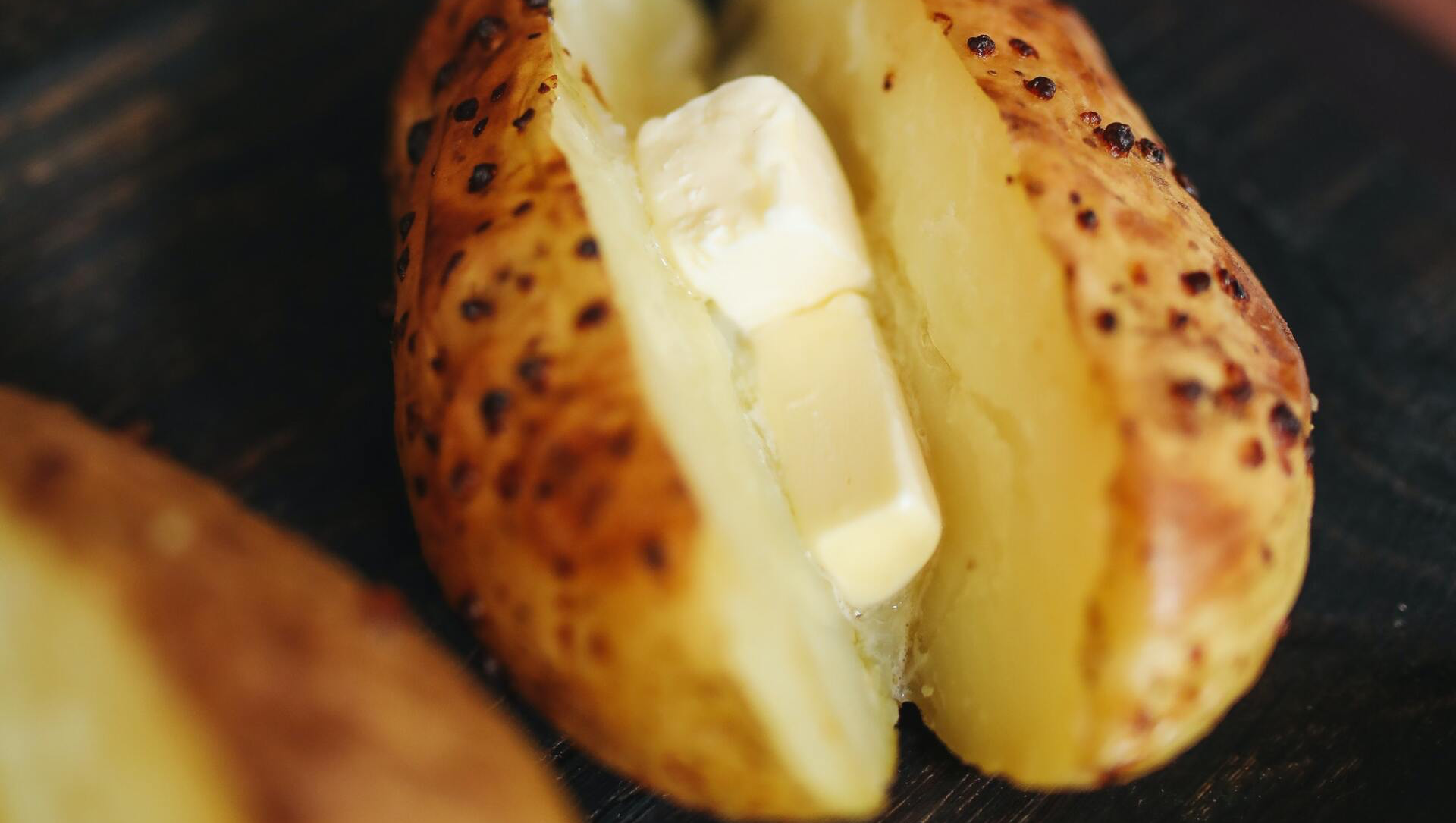 Baked potato with melting butter.