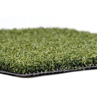Close-up of green artificial grass turf with a black backing on a white background