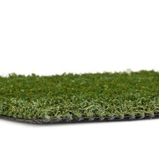 Close-up of green artificial grass turf on a white background