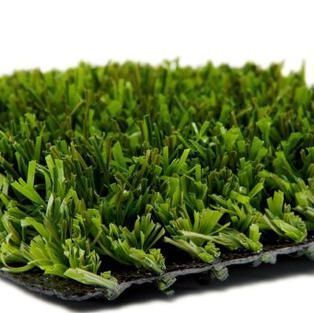 Close-up of dense green artificial grass turf with black backing