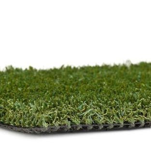 Roll of artificial grass turf on a white background