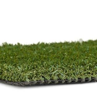 Close-up of green artificial grass turf on a white background