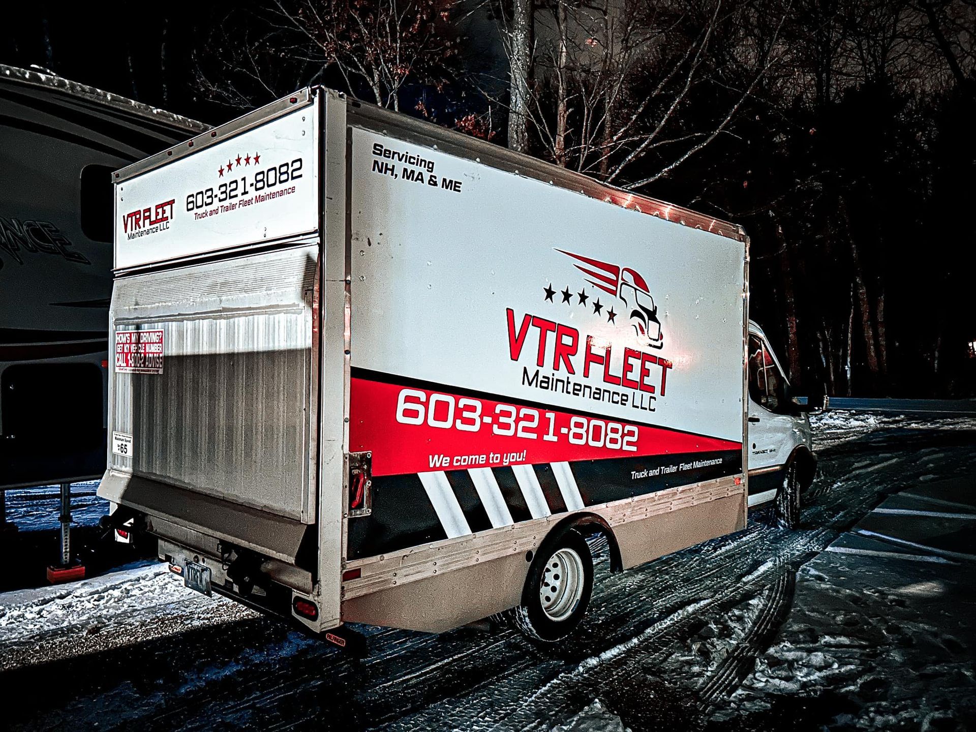 White VTR fleet truck on a snowy road with a red and black logo and phone number 603-321-8082.