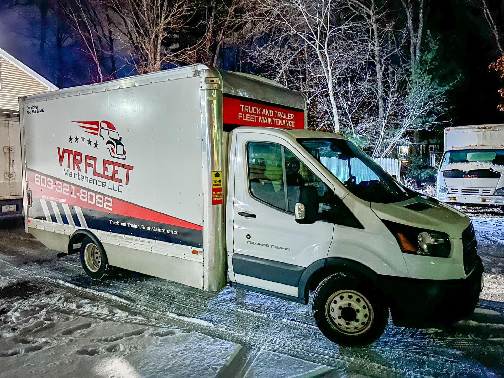 White VTR Fleet box truck parked outside in snowy conditions.