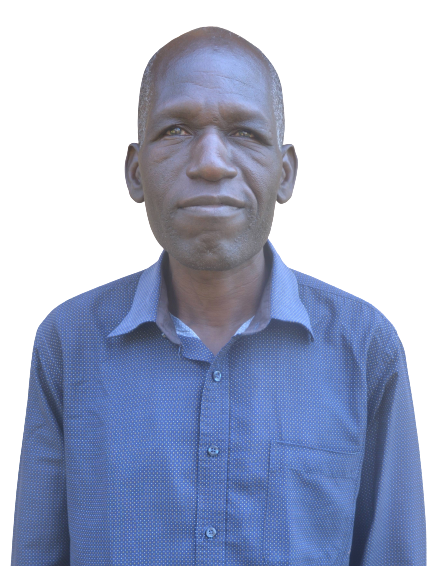 A man in a blue shirt stands in front of a white background