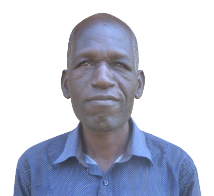A man in a blue shirt is looking at the camera