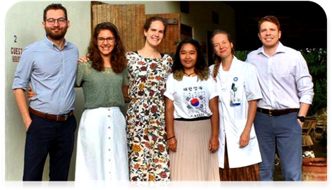A group of people are posing for a picture together.