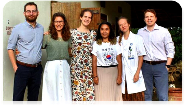 A group of people are posing for a picture together.