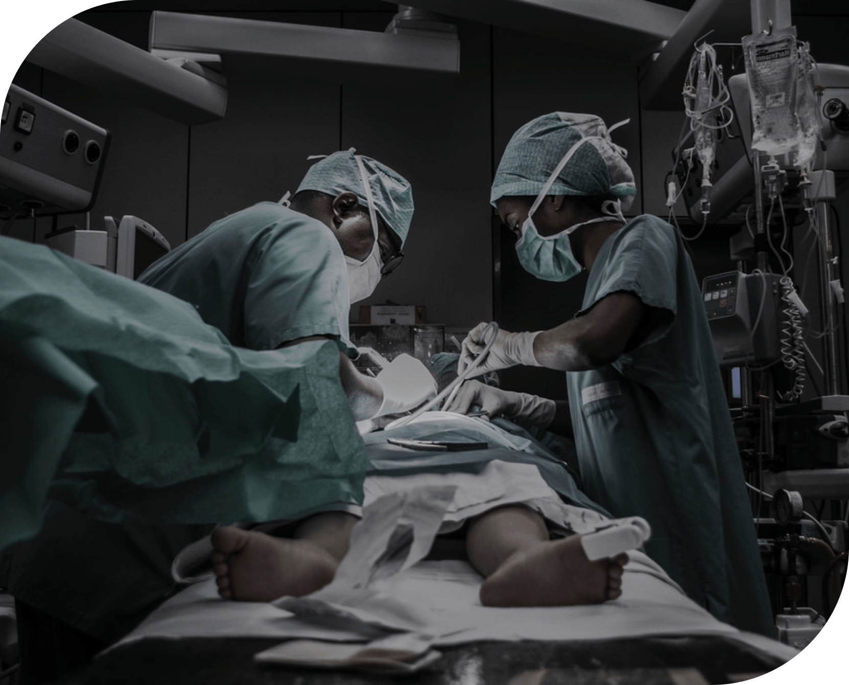Two surgeons are operating on a patient in an operating room.