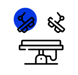 A black and white icon of a table with scissors on it.