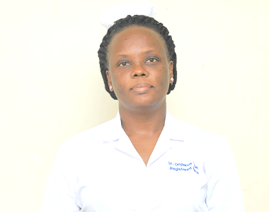 A nurse wearing a white coat and a white hat