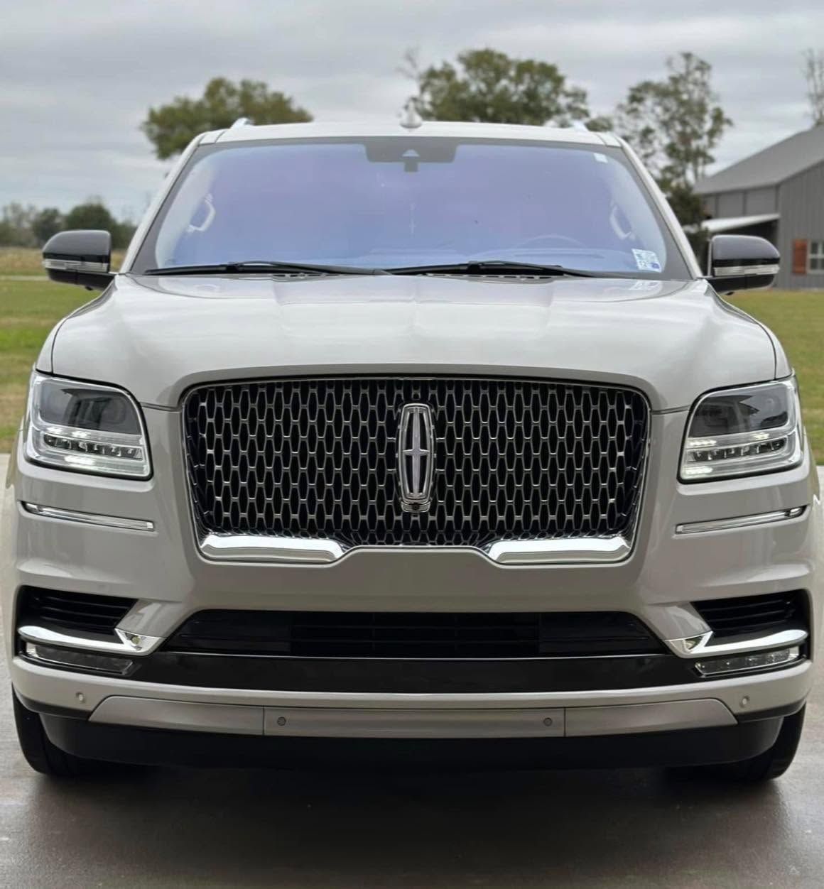 Front view of a silver Lincoln SUV parked outdoors