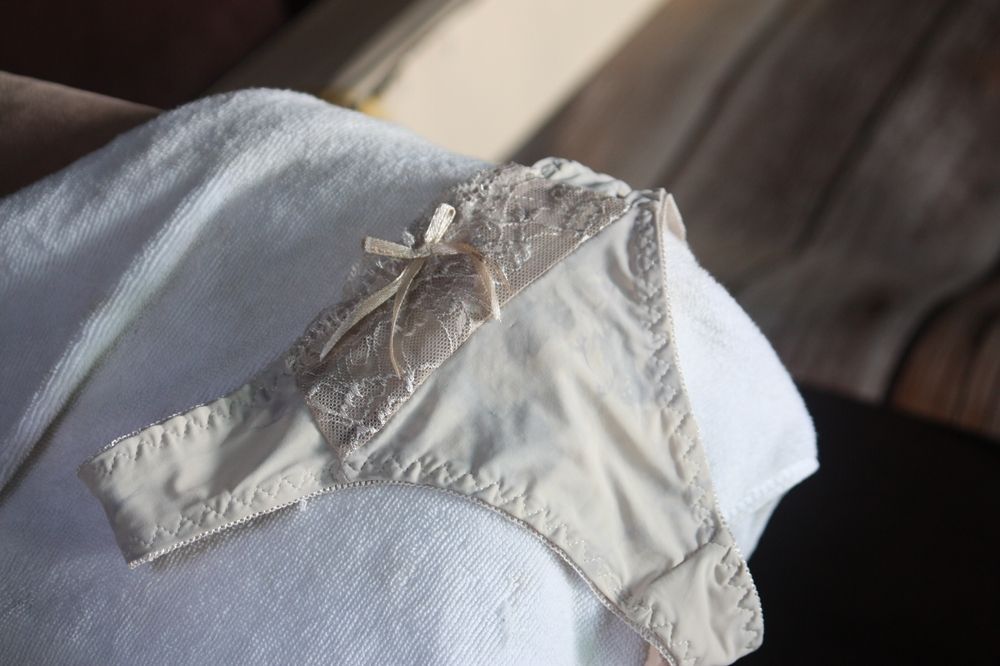 Beige Lace-trimmed Underwear on a White Towel — Shona's Lingerie in Kirwan, QLD