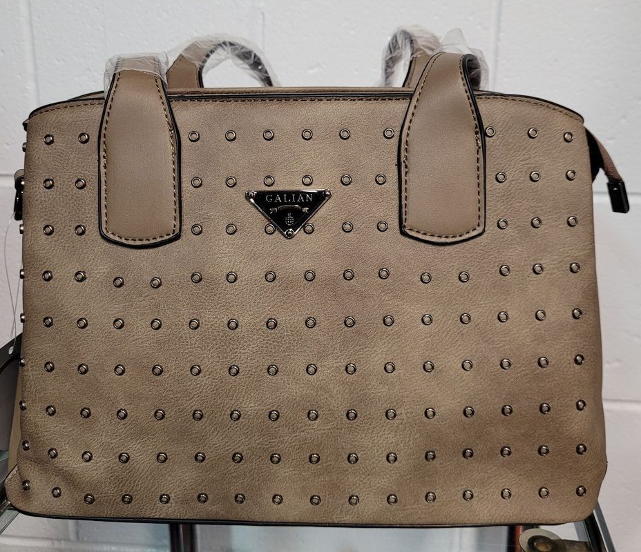Tan Studded Handbag With Handles and a Small Logo — Shona's Lingerie in Hermit Park, QLD