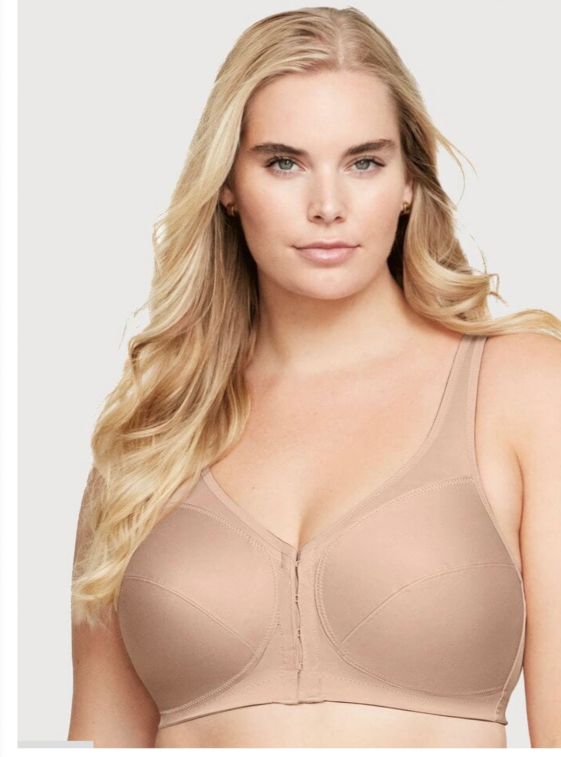 Blonde Woman Modeling a Beige Bra Against a Plain White Background — Shona's Lingerie in Hermit Park, QLD