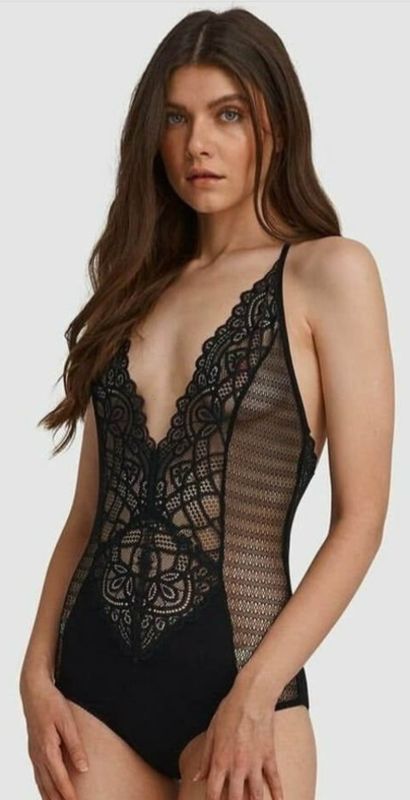 Woman Wearing a Black Lace Bodysuit, With a Plunging Neckline and Sheer Panels — Shona's Lingerie in Hermit Park, QLD