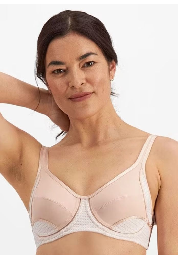 Woman in a Beige Bra, Arms Raised — Shona's Lingerie in Hermit Park, QLD