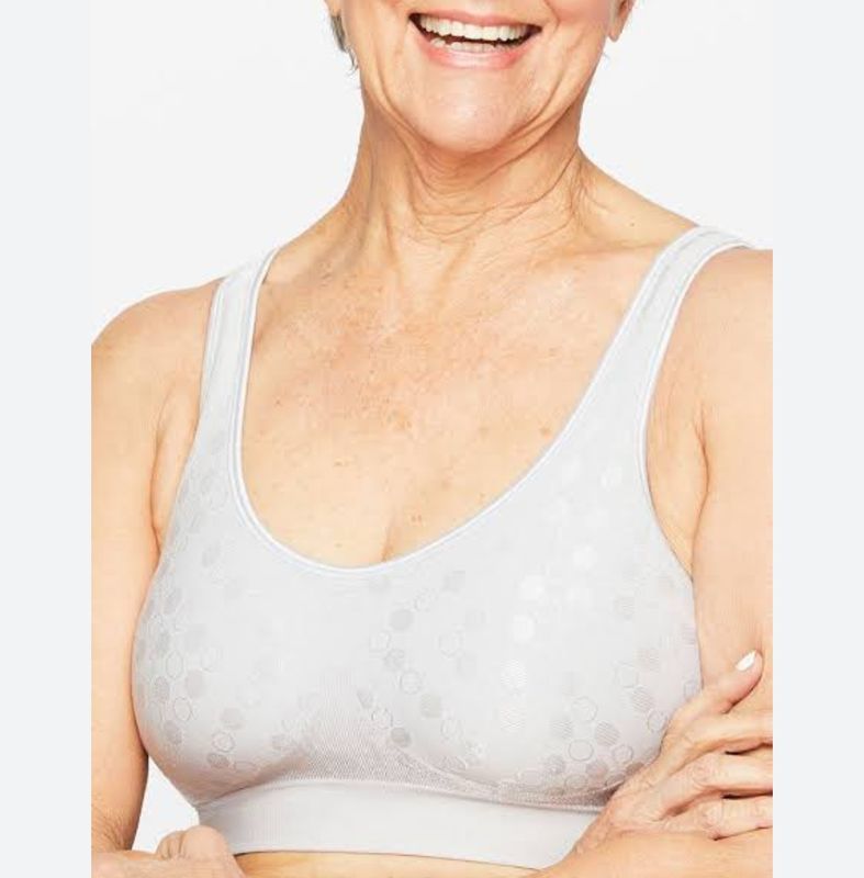 Woman Wearing a Light-coloured Patterned Bra, Smiling, Arms Crossed — Shona's Lingerie in Hermit Park, QLD