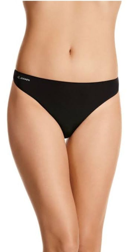 Woman Wearing Black Thong Underwear, Standing Against a White Background — Shona's Lingerie in Hermit Park, QLD