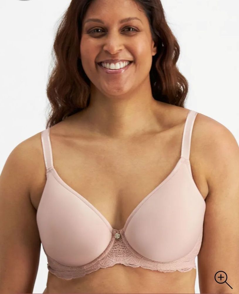 Woman Wearing a Pink Bra, Smiling, in Front of a White Background — Shona's Lingerie in Hermit Park, QLD