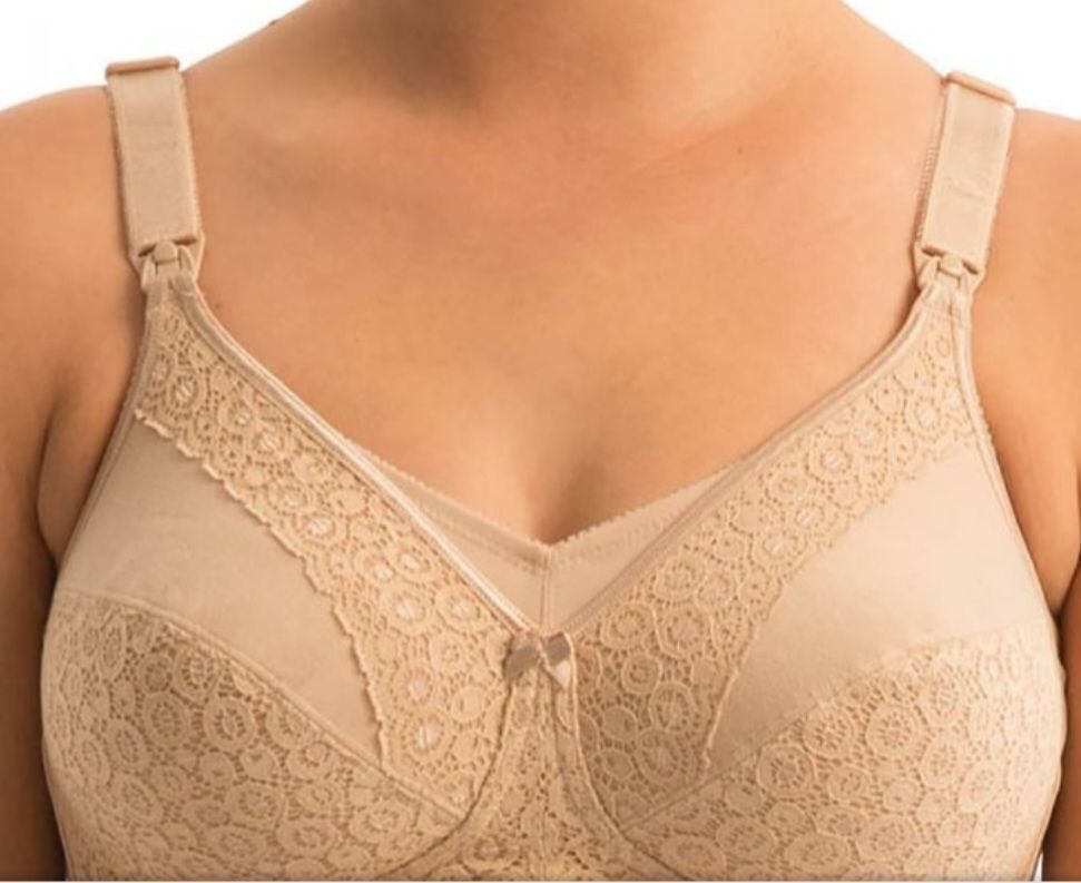 Beige Lace-trimmed Bra Worn by a Person, With Wide Straps and a Center Bow — Shona's Lingerie in Hermit Park, QLD