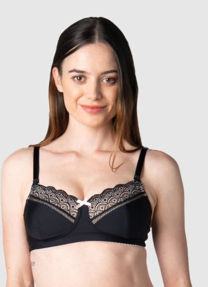 Woman Wearing a Black Bra With Beige Lace Trim, Smiling — Shona's Lingerie in Hermit Park, QLD