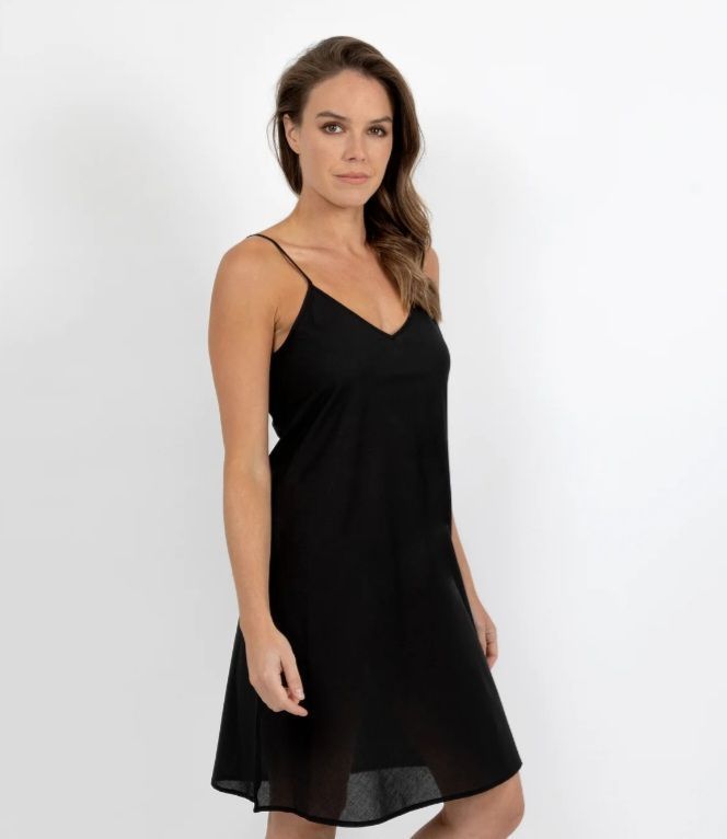 Woman Wearing a Black Slip Dress, Standing in Front of a White Background — Shona's Lingerie in Hermit Park, QLD