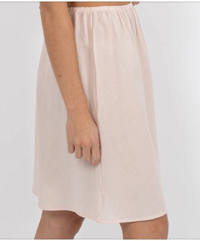 Woman Wearing a Light Pink Slip Skirt, Covering the Hips and Thighs — Shona's Lingerie in Hermit Park, QLD