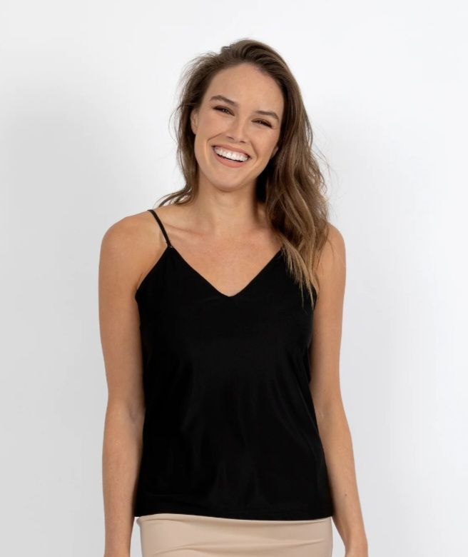 Woman Smiling, Wearing Black v-neck Camisole Over a Tan Skirt — Shona's Lingerie in Hermit Park, QLD