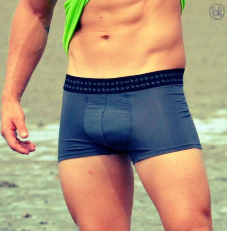 Man in Grey Boxer Briefs, Lifting a Green Shirt, Outdoors — Shona's Lingerie in Hermit Park, QLD