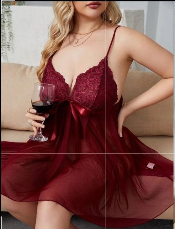 Woman in Burgundy Lingerie Holding a Glass of Wine, Sitting on a Sofa — Shona's Lingerie in Hermit Park, QLD