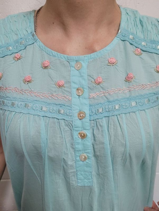 Light Blue Shirt With Pink Floral Embroidery and Buttons — Shona's Lingerie in Hermit Park, QLD