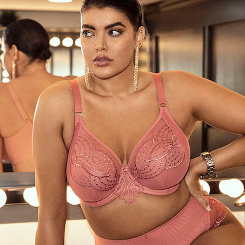 Woman in a Pink Bra and Underwear, Looking Away, in Front of a Mirror With Lights — Shona's Lingerie in Hermit Park, QLD