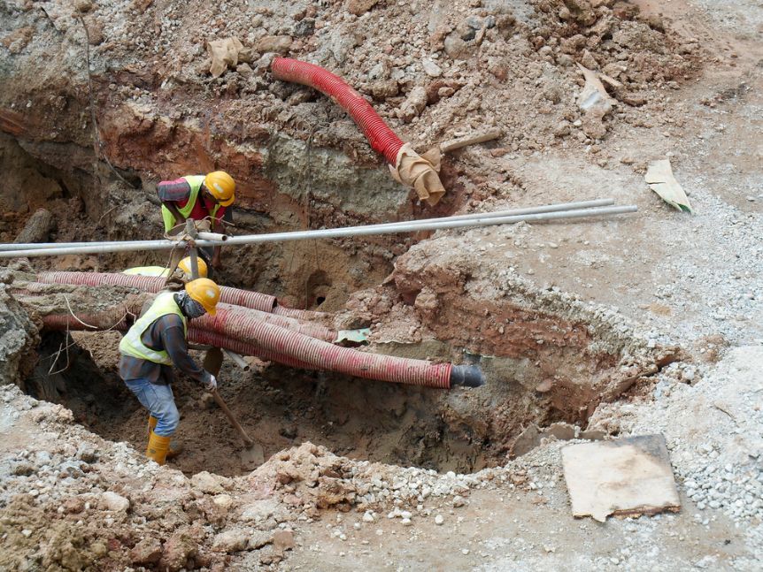 Construction Worker Install and Fixing Utility — Austar Underground Services in Katherine, NT