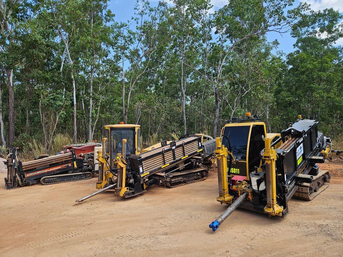 Three Horizontal Directional Drilling Machines in a Wooded Area — Austar Underground Services in Girraween, NT