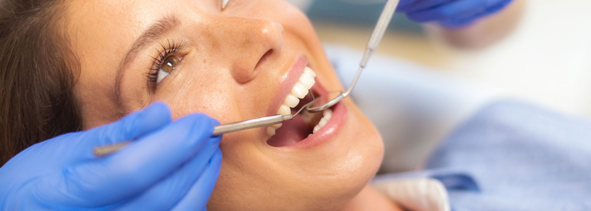 Patient receiving a dental consultation from a friendly dentist in a dentist office