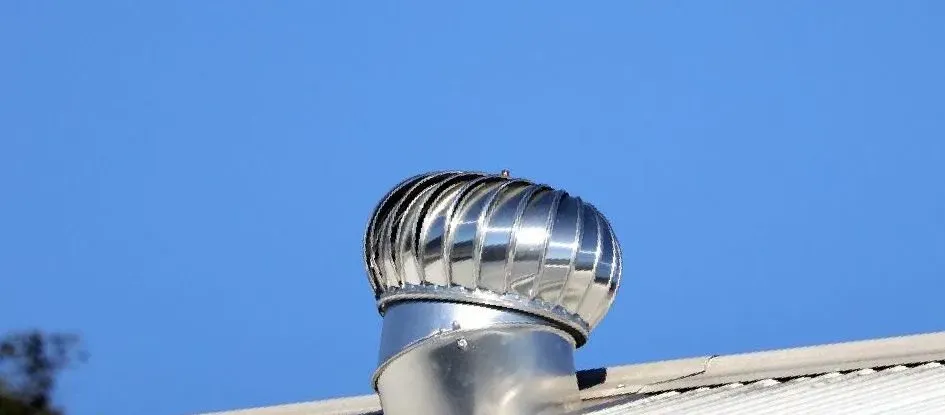 A Roof With A Fan On Top Of It And A Blue Sky In The Background — Roofer in Toowoomba, QLD