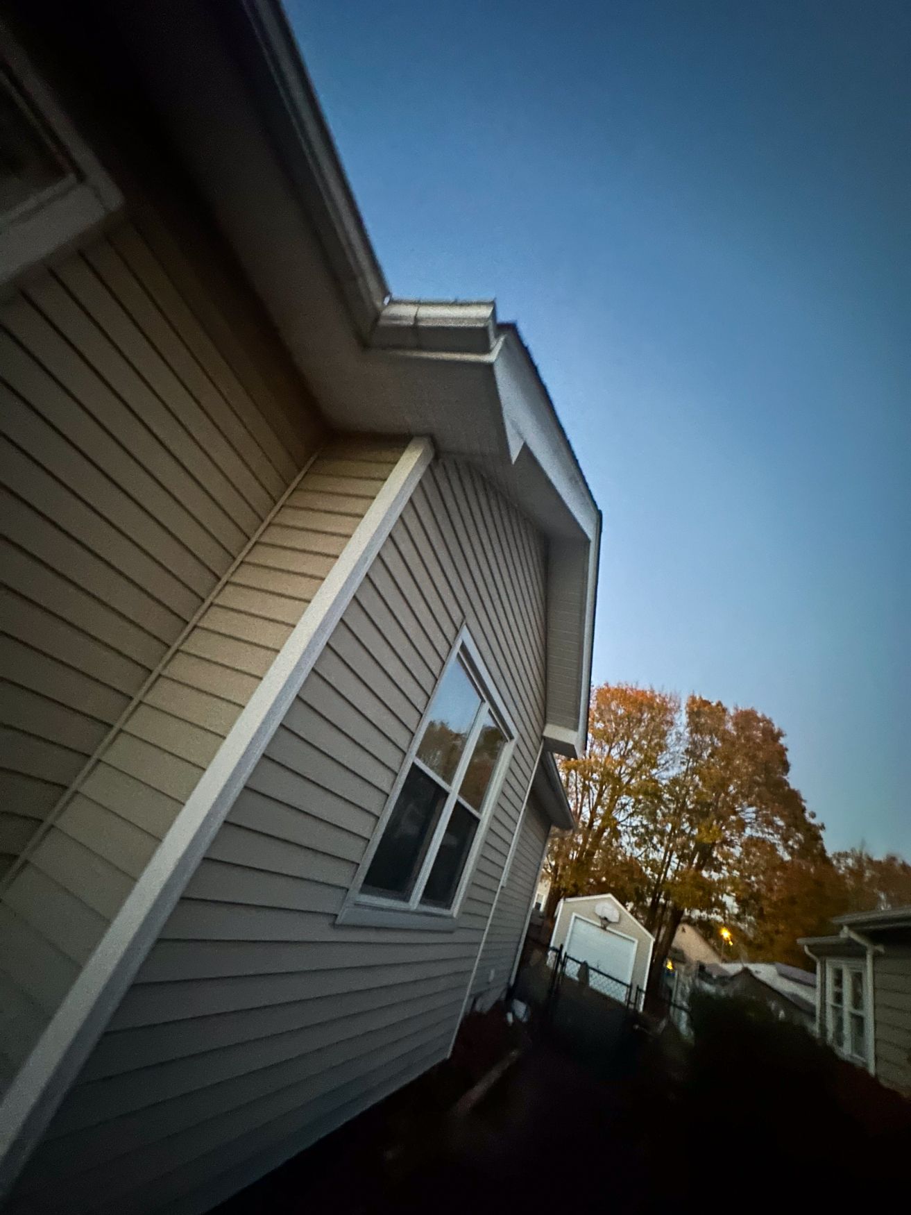 Insulated vinyl siding installed on a home exterior to improve winter energy efficiency
