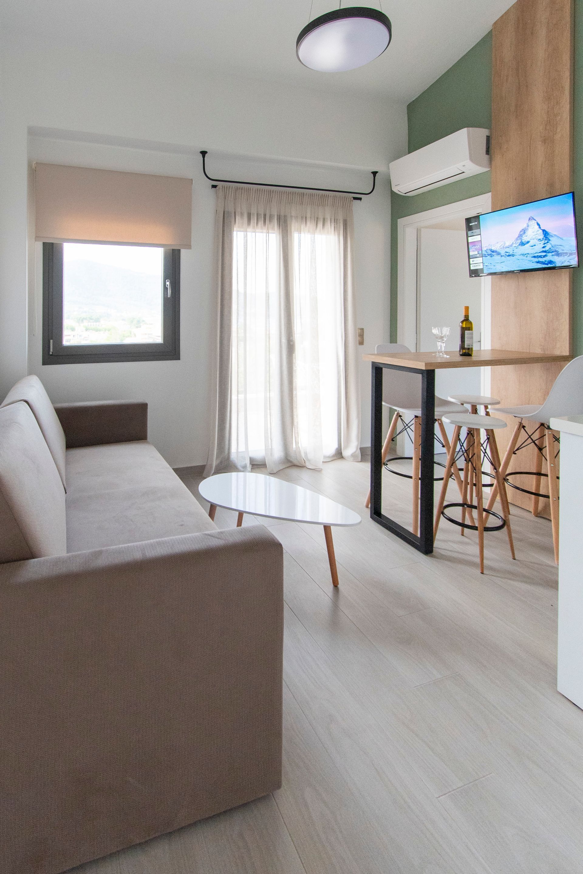 A living room with a couch , table , and television.