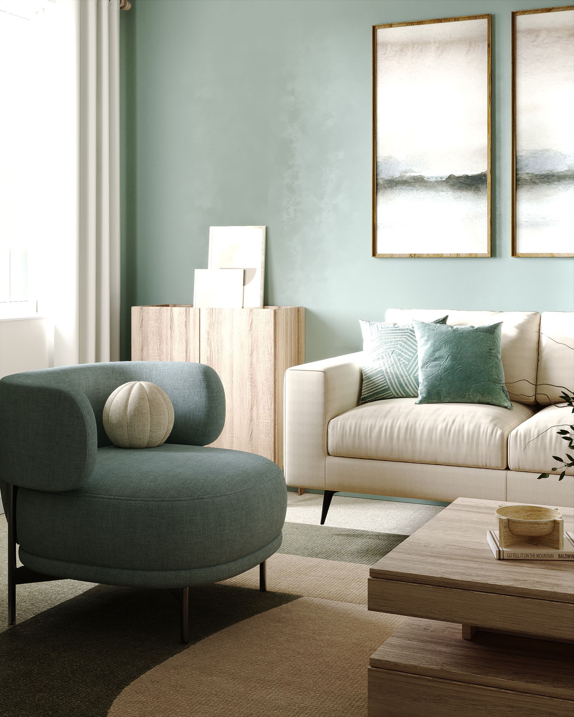 Close‑up of teal accent chair, cream sofa and wood sideboard against sage green feature wall in modern living room.