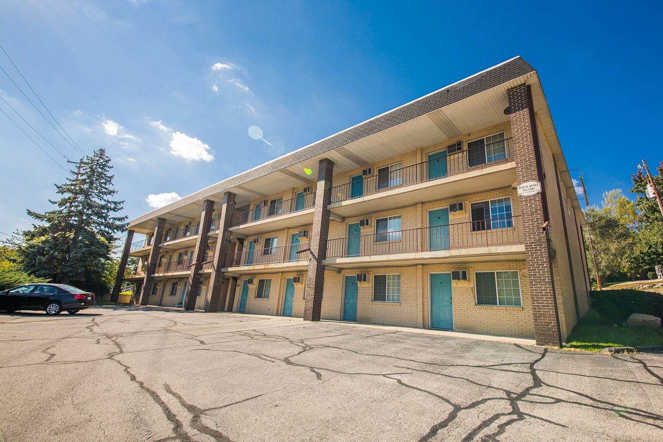 Photo showing a 3 story building from a 3/4 view
