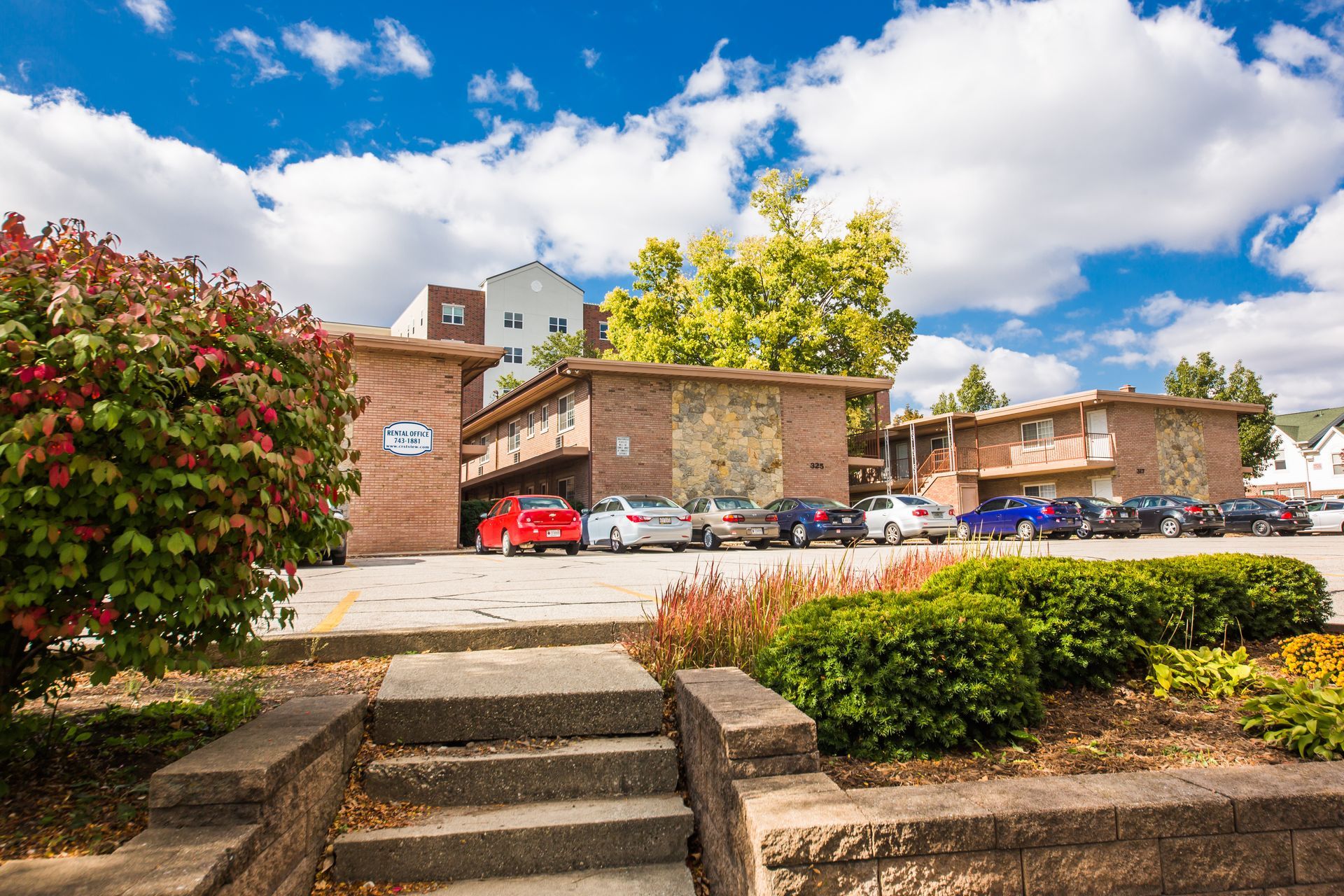 Photo showing a group of 2 story buildings in the background with steps in the foreground