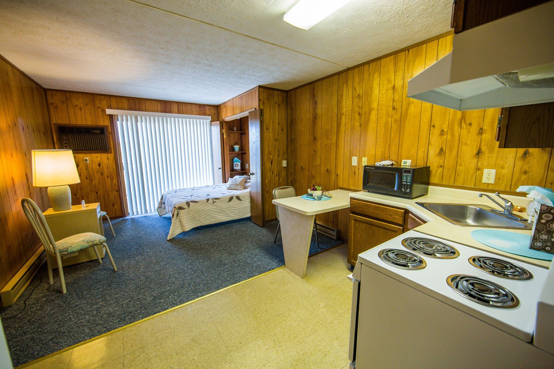 Photo showing a studio with the living room in the background