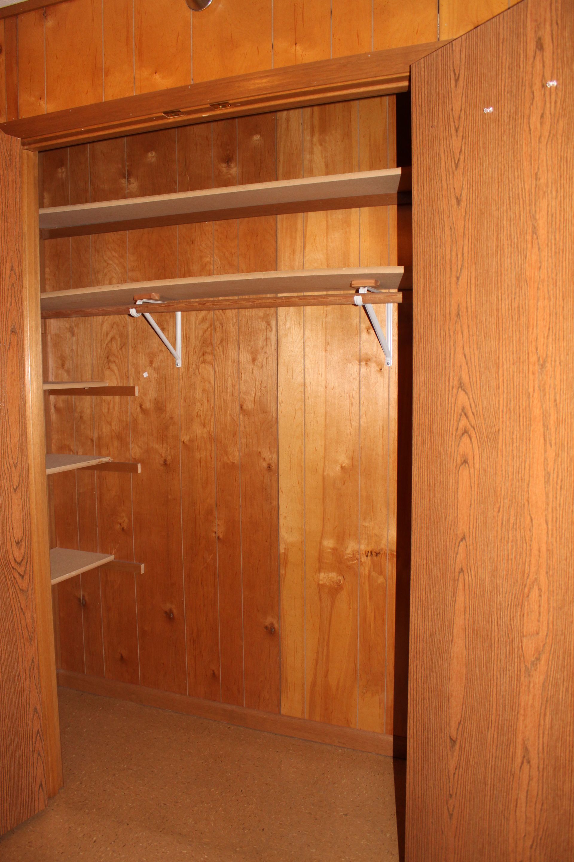 Photo showing a closet with built-in shelves
